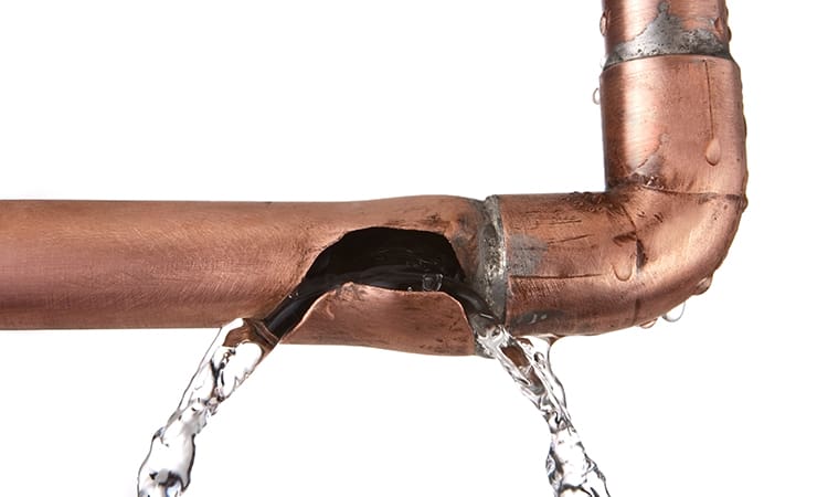 Photo of a leaking copper pipe