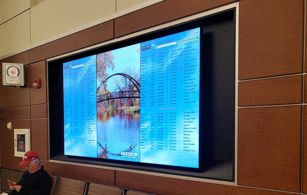 Photo of video wall at the Dane County Airport installed by Fearing's Audio Video Security