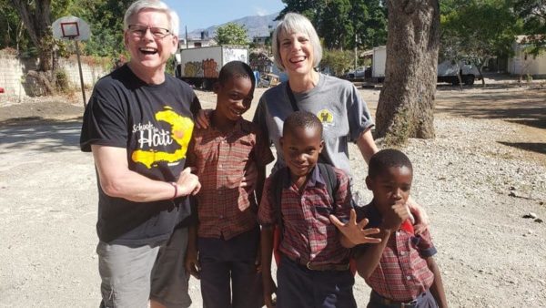 Doug and Lois with three boys in Haiti