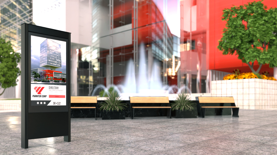 A digital signage kiosk displaying a directory for a glass commercial building.